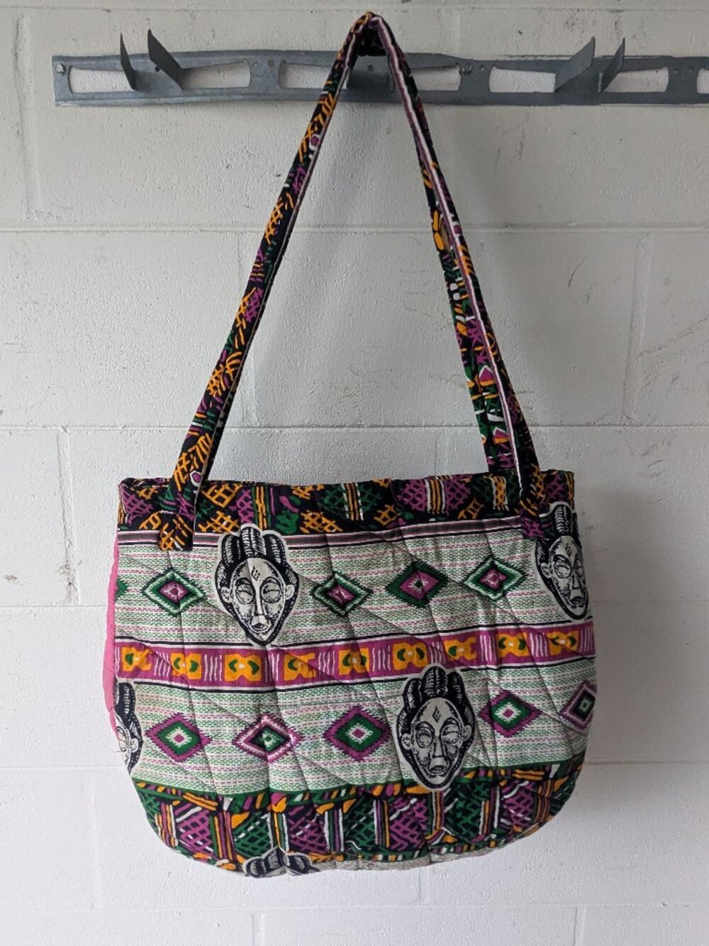 quilted fabric shoulder bag vibrant tribal mask colorful geometric pattern